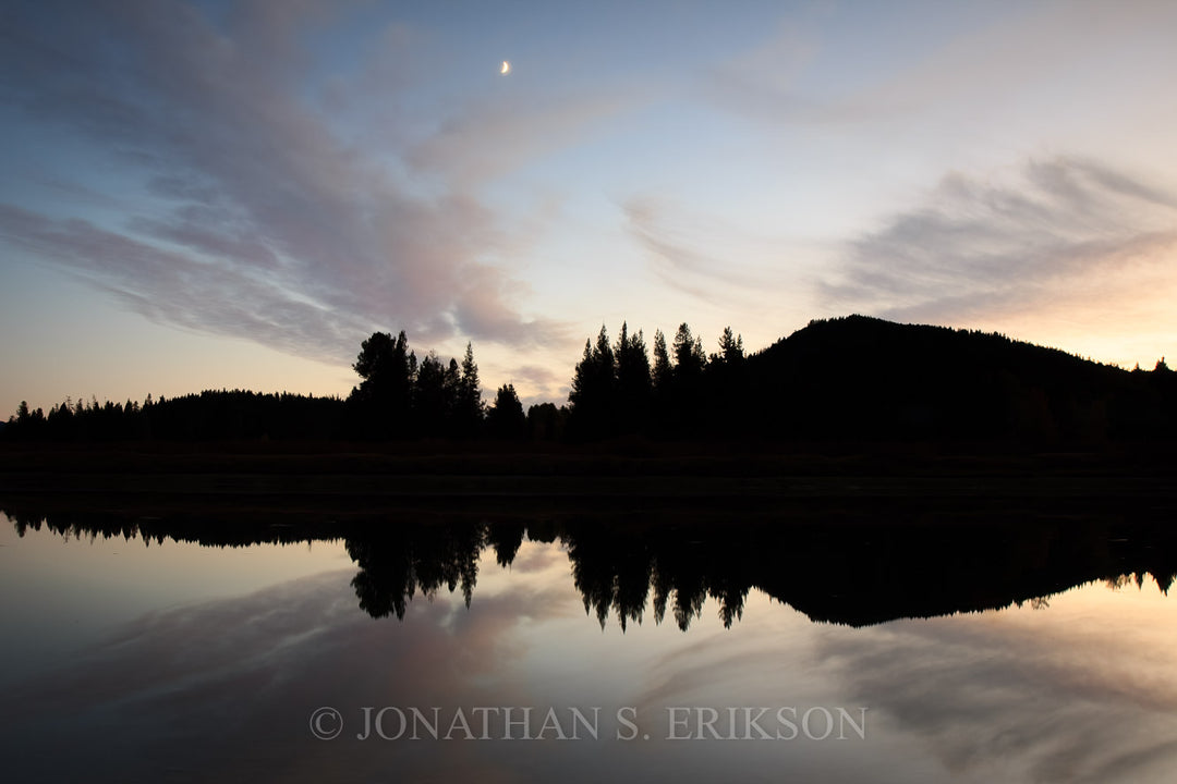 Mirror Image. Evening light at Oxbow Bend reflect on still water like glass mirror.