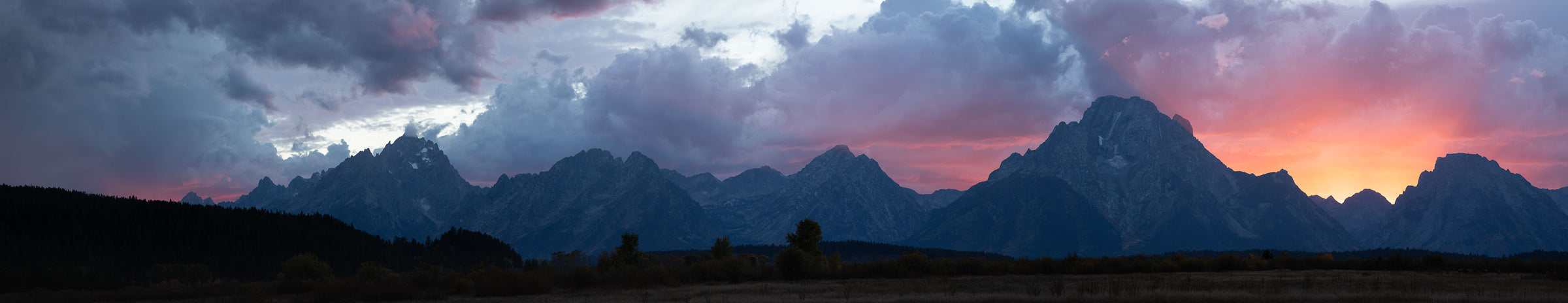 Now the Day Is Over. Grand Teton panoramic view with a blaze of sunset colors.