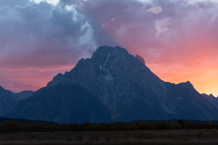 Now the Day Is Over. Grand Teton panoramic view with a blaze of sunset colors.